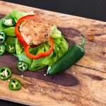 Jalapeno Chicken Burger on wooden cutting board